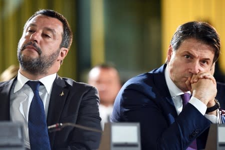 FILE PHOTO: Italian Interior Minister Matteo Salvini and Italian Prime Minister Giuseppe Conte attend a commemoration ceremony to mark the anniversary of the assassinations of judges Giovanni Falcone, and Paolo Borsellino, in Palermo