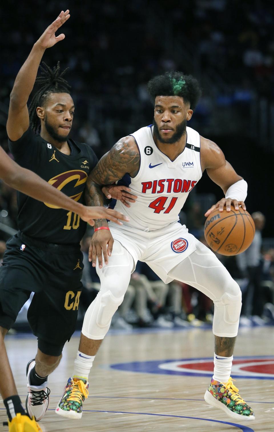 Detroit Pistons forward Saddiq Bey (41) drives against Cleveland Cavaliers guard Darius Garland (10) during the first half at Little Caesars Arena in Detroit on Sunday, Nov. 27, 2022.
