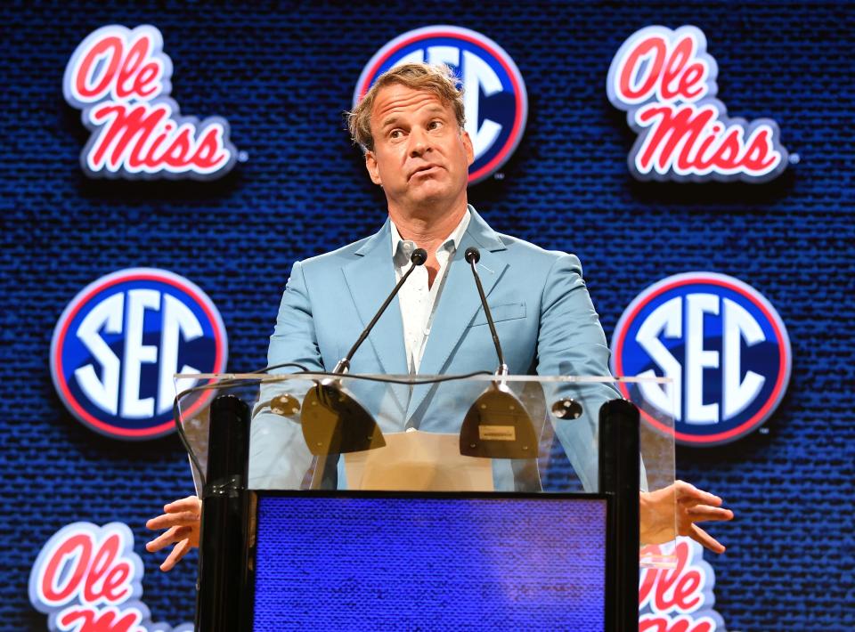 Ole Miss coach Lane Kiffin answers reporters' questions at SEC Media Day last month in Nashville.