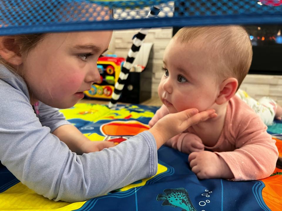 Isa enjoys spending time with her four-year-old sister Temperance. “She giggles almost every time she’s around her older sister,” Isa's father John Slish says. (Photo courtesy Gerber / Slish family)