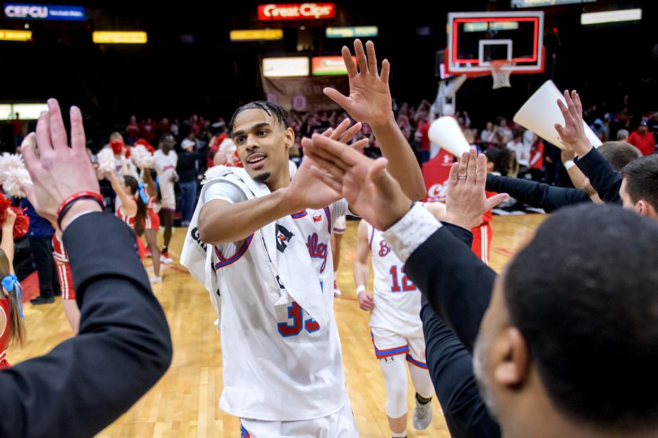Bradley's Darius Hannah high-fives his coaching staff as the Braves come off the court after their 95-72 victory over Belmont on Saturday, Jan. 20, 2024 at Carver Arena in Peoria.