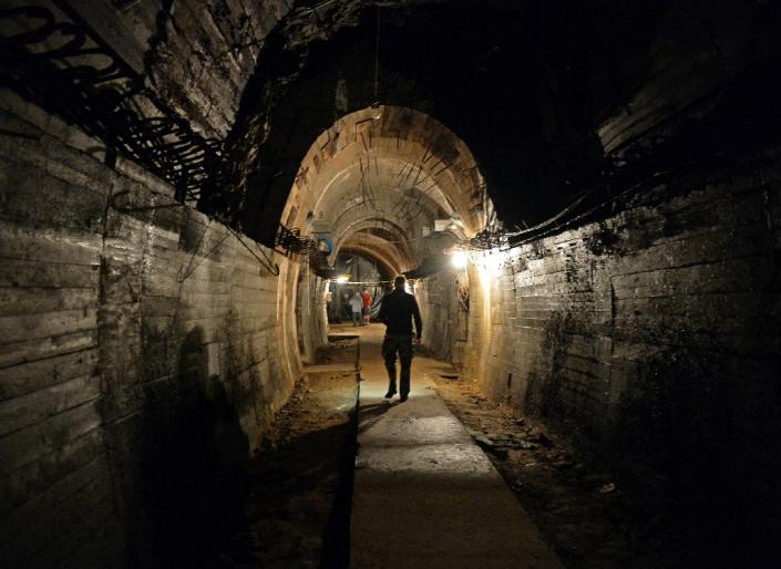 Men walk in underground galleries on August 28, 2015 under the Ksiaz castle in the area where a Nazi gold train is supposedly hidden in Walbrzych, Poland (AFP Photo/Janek Skarzynski)