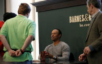 Golfer Tiger Woods signs copies of his new book "The 1997 Masters: My Story" at a book signing event at a Barnes & Noble store in New York City, New York, U.S., March 20, 2017. REUTERS/Mike Segar