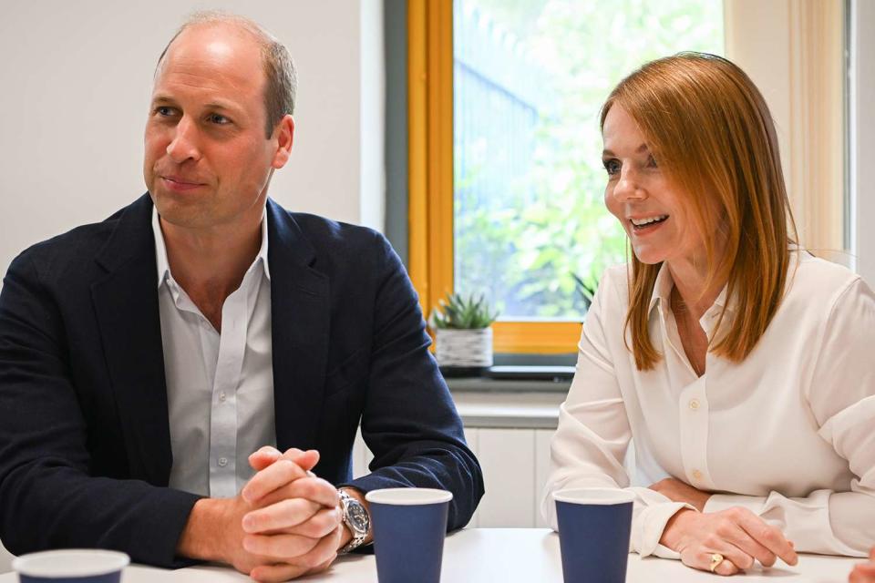 <p>Finnbarr Webster/Getty Images</p> Prince William and Geri Halliwell-Horner discuss Homewards project in Wales on June 26