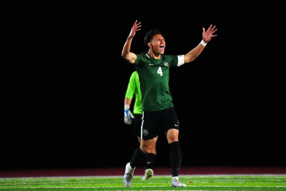 San Luis senior Israel Uribe (4) pumps up the crowd against Perry during the 6A Championship soccer game at Dobson High School in Mesa on Feb. 25, 2023.