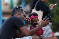 People use the internet at a hotspot in Havana, Cuba, December 18, 2018. REUTERS/Stringer