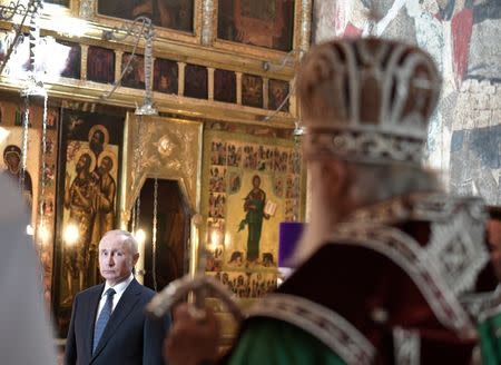 Russian President Vladimir Putin attends a prayer service at the Cathedral of the Annunciation after an inauguration ceremony at the Kremlin in Moscow, Russia May 7, 2018. Sputnik/Alexei Nikolsky/Kremlin via REUTERS