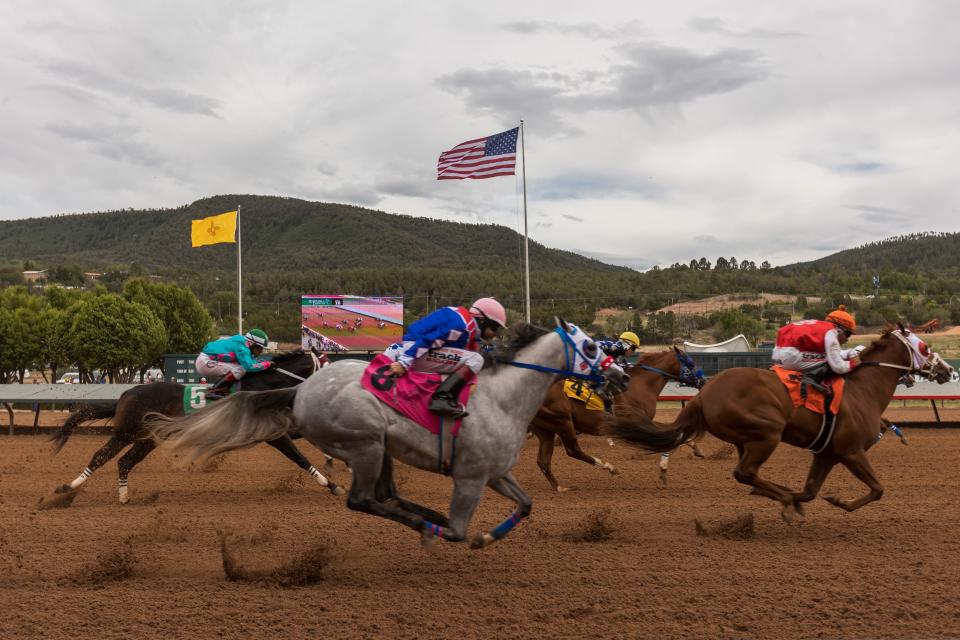 Horses race in the tenth 350-yard Ruidoso Futurity Quarter Horse Trials race at the Ruidoso Downs Racetrack and Casino in Ruidoso, New Mexico, on Saturday, May 27, 2023.