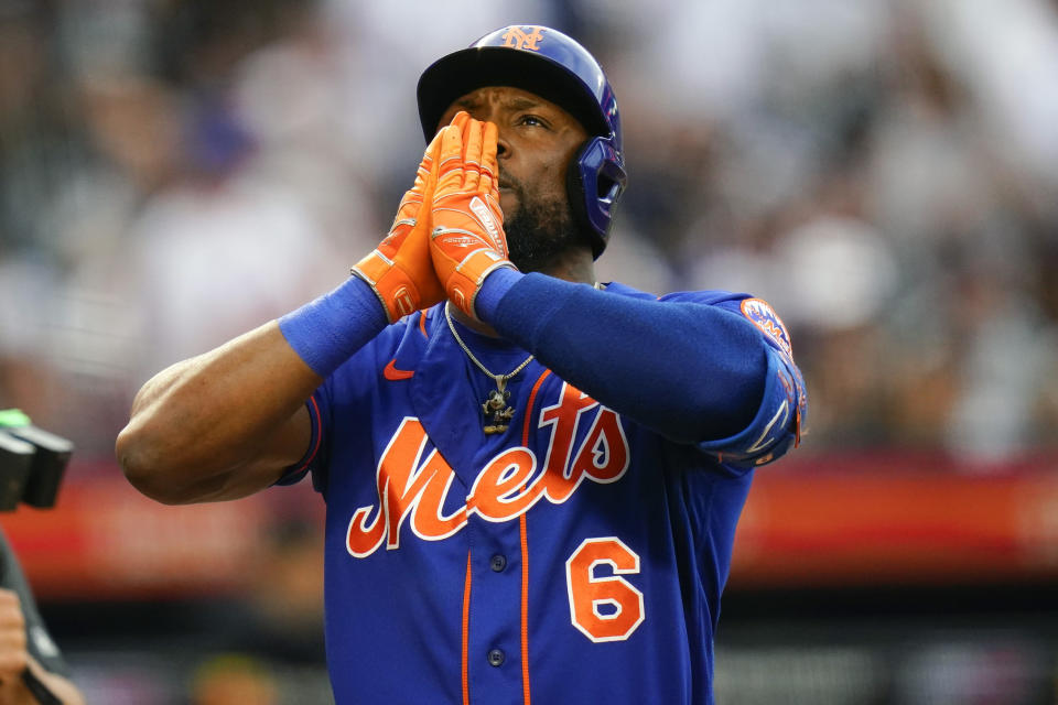 New York Mets' Starling Marte gestures after hitting a home run during the first inning of a baseball game against the New York Yankees Tuesday, July 26, 2022, in New York. (AP Photo/Frank Franklin II)