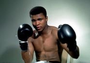 Muhammad Ali poses with gloves in this undated portrait.Mandatory Credit: Action Images / Sporting Pictures/File Photo