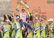 FILE PHOTO: Italy's Ivan Basso, wearing the leader's pink jersey, celebrates winning the 101st Giro d'Italia after the 21st and final stage of the race at the ancient arena of Verona.