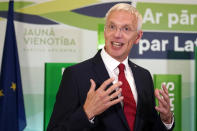 Latvian Prime Minister and Head of board of leading political party Jauna Vienotiba (New Unity) Krisjanis Karins gestures as he speaks to the media while awaiting the results of parliament elections, in Riga, Latvia, Saturday, Oct. 1, 2022. Latvians have held general election that has been influenced by neighboring Russia's attack on Ukraine. An exit poll shows the center-right New Unity party of Prime Minister Krisjanis Karins emerging as the top vote-getter, capturing 22.5% support. Karins currently leads a four-party minority coalition. (AP Photo/Roman Koksarov)