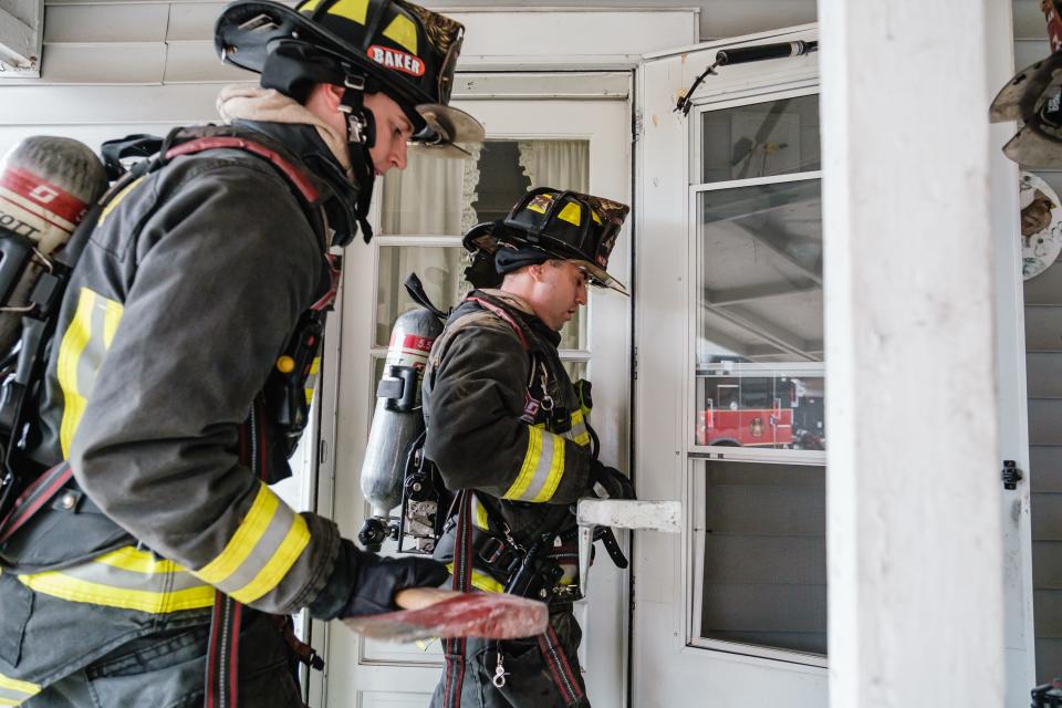 New Philadelphia firefighters practice forced entry during search and rescue training exercises at a vacant home on West High Avenue in New Philadelphia.