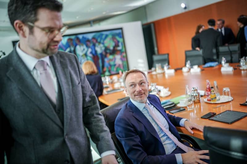 German Minister of Justice Marco Buschmann (L) and Minister of Finance Christian Lindner attend the weekly meeting of the Federal Cabinet in the Federal Chancellery. Kay Nietfeld/dpa