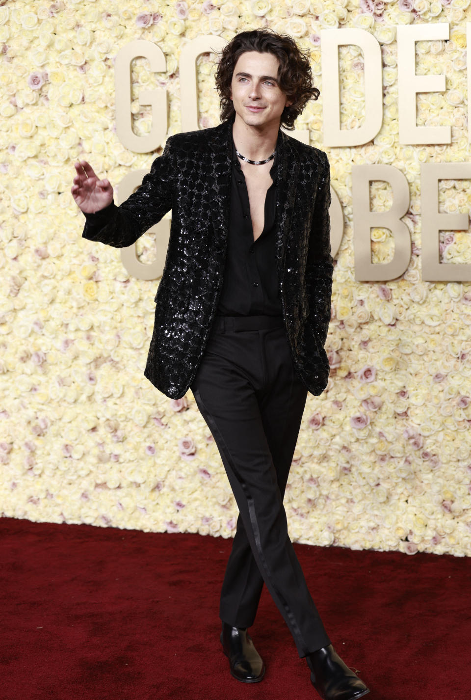 "Wonka" star Timothée Chalamet wore an edgy look by Celine for his red carpet appearance at the Golden Globes. (Image via Getty Images)