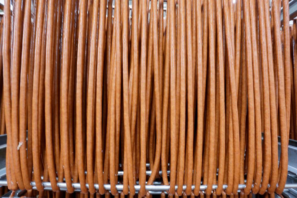 A rack of snack sticks ready to be smoked at Old Wisconsin Sausage, Wednesday, July 27, 2022, in Sheboygan, Wis.