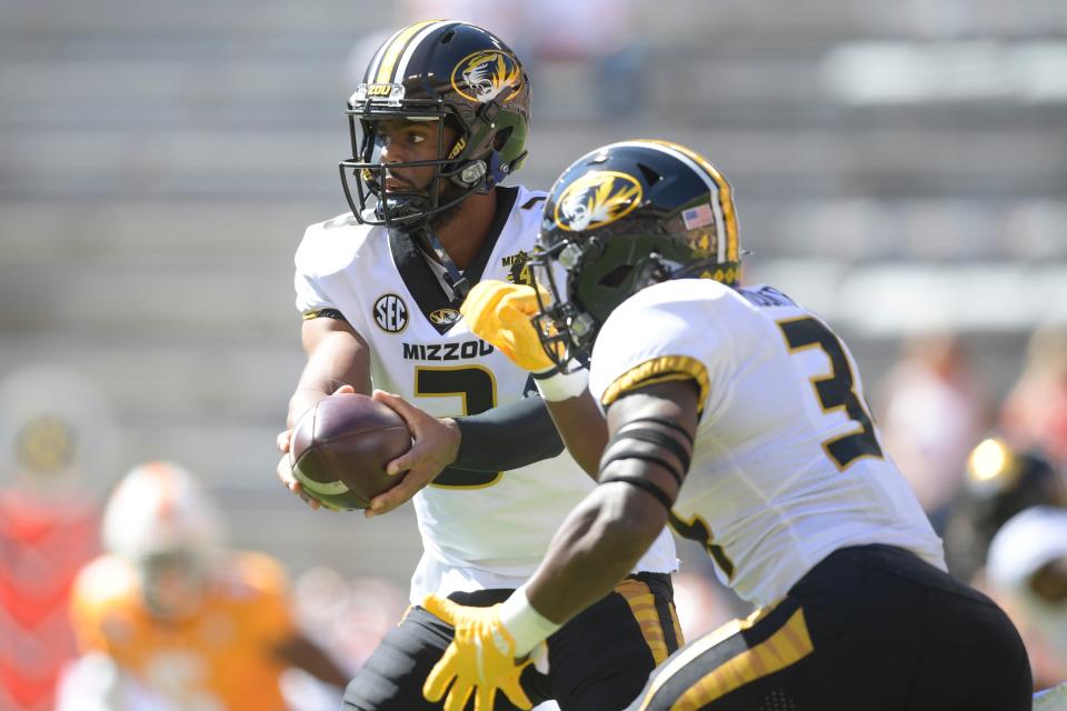 Missouri quarterback Shawn Robinson (3) hands the ball off to running back Larry Rountree (34) during a Southeastern Conference game in 2020 at Neyland Stadium in Knoxville, Tenn.