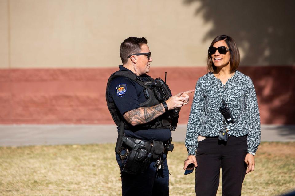 Officer Jessica McCloskey speaks to Principal Joey Tokhi during recess at Sunset Hills Elementary School on Nov. 30, 2023.