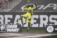 Oregon wide receivers Devon Williams, rear, and Jaylon Redd (30) celebrate Williams' touchdown during the first half of the team's NCAA college football game against Oregon State in Corvallis, Ore., Friday, Nov. 27, 2020. (AP Photo/Amanda Loman)