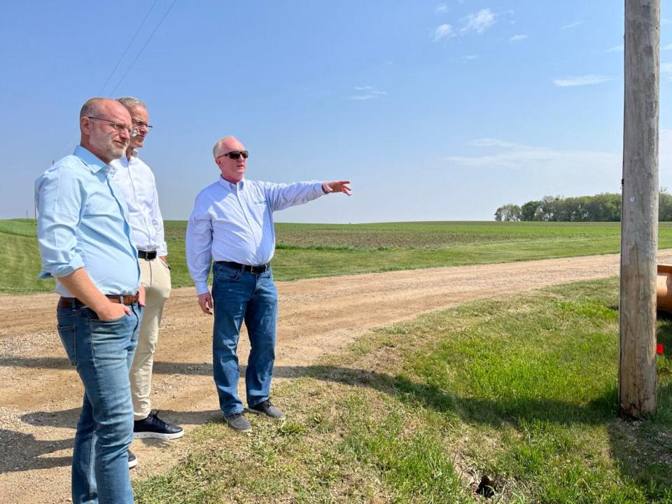 Golden West CEO Denny Law shows Federal Communications Commissioner Brendan Carr and Sen. John Thune, R-South Dakota, a broadband expansion site near Colton.