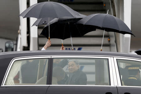 FILE PHOTO: Japan's Emperor Akihito (C) and Empress Michiko (front L) get out of their car, as they board a special flight for a visit to Palau, at Haneda international airport in Tokyo April 8, 2015. REUTERS/Issei Kato/File Photo