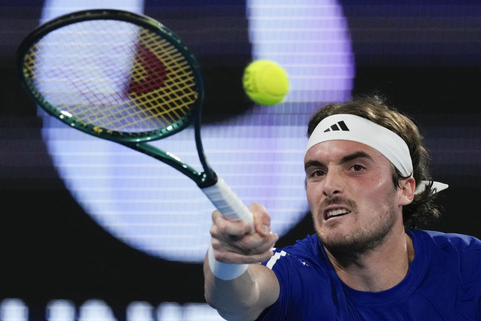 Stefanos Tsitsipas of Greece plays a forehand return to Germany's Alexander Zverev during their United Cup quarterfinal tennis match in Sydney, Australia, Friday, Jan. 5, 2024. (AP Photo/Mark Baker)