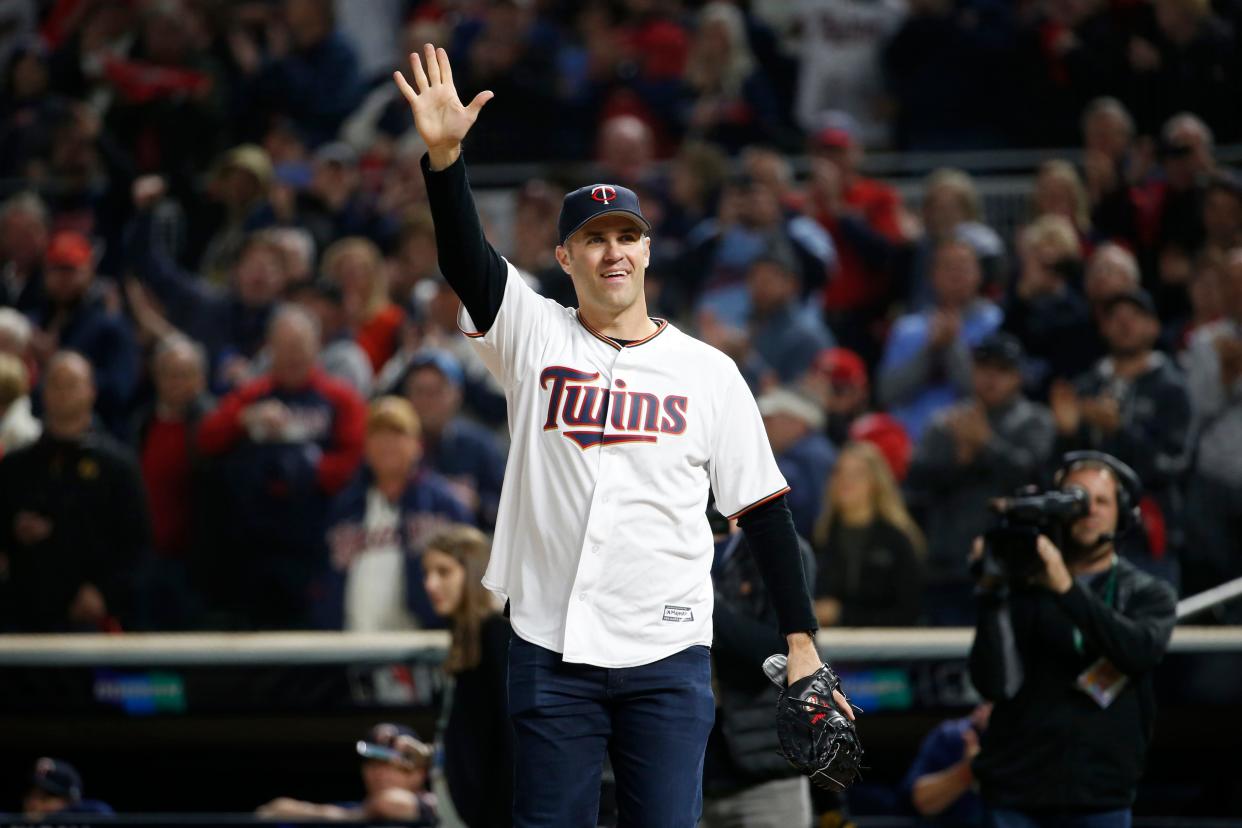 Former Minnesota Twins player Joe Mauer waves to fans before Game 3 of a baseball American League Division Series between the Twins and the New York Yankees, Monday, Oct. 7, 2019, in Minneapolis. (AP Photo/Bruce Kluckhohn)