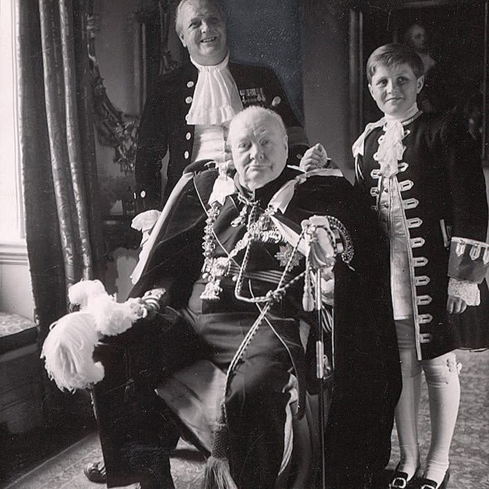 Sir Winston Churchill, his son Randolph (back left) and his grandson Winston, in Coronation robes, 1953 - Bridgeman Images