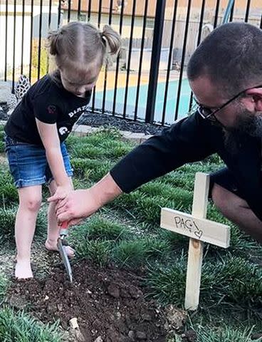 <p>Courtesy of Courtney Bishop</p> Jake Bishop and Hazel during pacifier funeral.