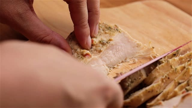 slice chicken into slices with a knife