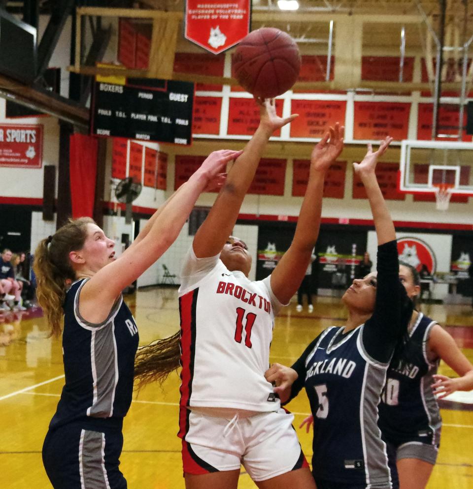 #11 Sunali Carter of Brockton manages to get off a shot despite the Rockland defense coming at her from all sides in the 2nd half of the game on Friday, Dec. 8, 2023.