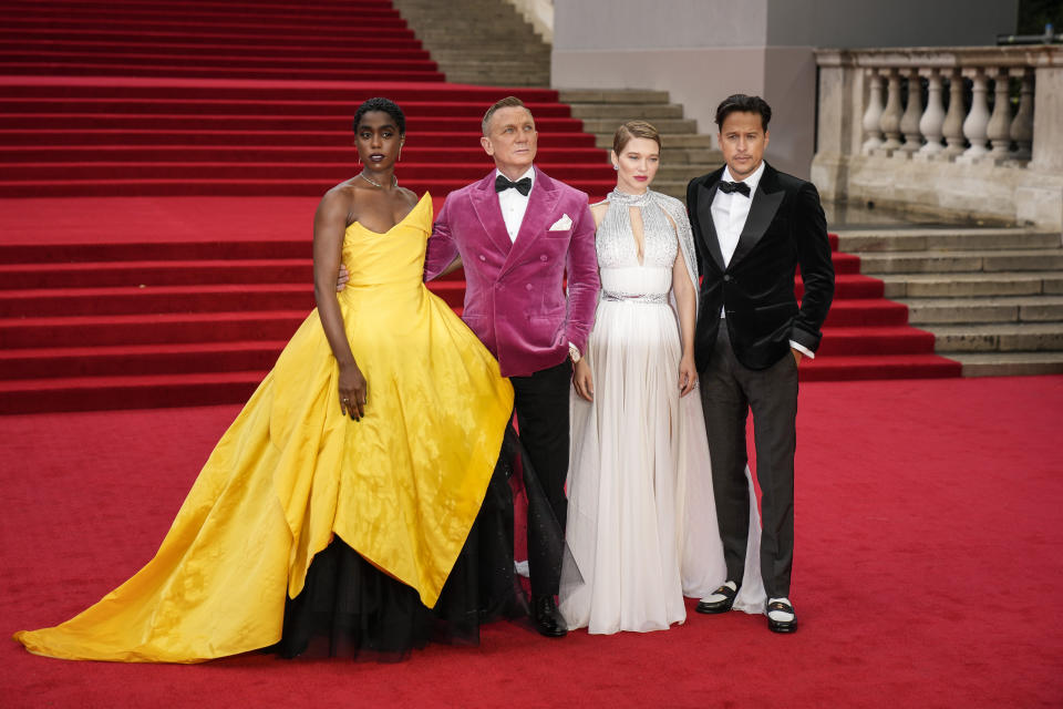 Lashana Lynch, from left, Daniel Craig, Lea Seydoux and Cary Joji Fukunaga pose for photographers upon arrival for the World premiere of the new film from the James Bond franchise 'No Time To Die', in London Tuesday, Sept. 28, 2021. (AP Photo/Matt Dunham)