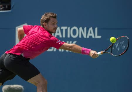 Jul 30, 2016; Toronto, Ontario, Canada; Stan Wawrinka of Switzerland reaches for a ball during the semi final match against Kei Nishikori of Japan (not pictured) during the Rogers Cup tennis tournament at Aviva Centre. Kei Nishikori of Japan won 7-6, 6-1. Mandatory Credit: Nick Turchiaro-USA TODAY Sports