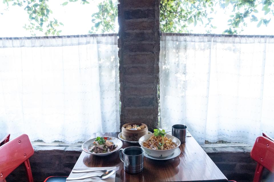 Yum woon sen, left, and Kao soi, right, are displayed at Glai Baan in Phoenix on December 13, 2023.