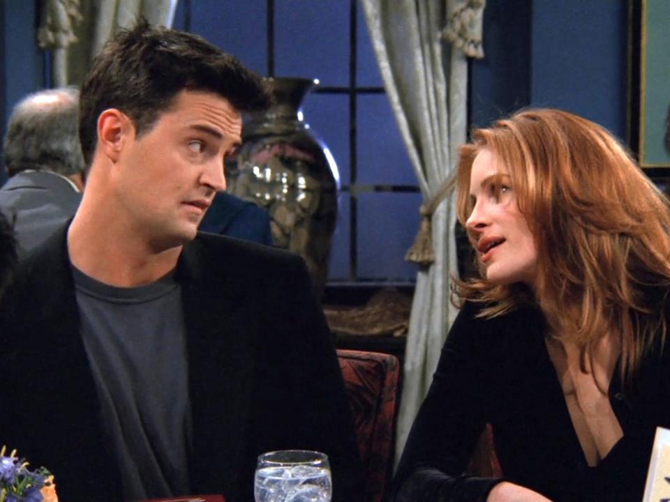 Matthew Perry as Chandler Bing and Julia Roberts as Susie Moss on season two of "Friends."