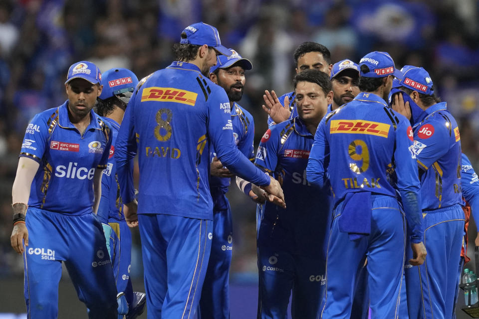 Mumbai Indians' Piyush Chawla, centre, celebrates the wicket of Sunrisers Hyderabad's Heinrich Klaasen with teammates during the Indian Premier League cricket match between Mumbai Indians and Sunrisers Hyderabad in Mumbai, India, Monday, May 6, 2024. (AP Photo/Rajanish Kakade)