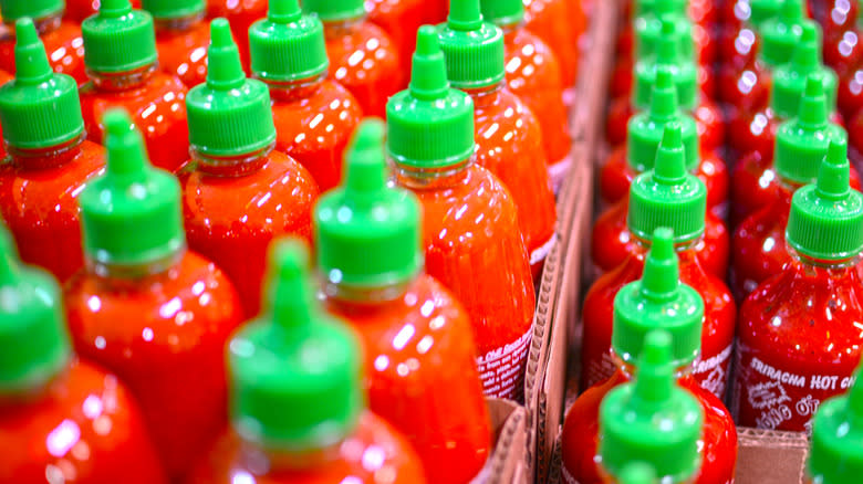 sriracha bottles in cardboard packaging