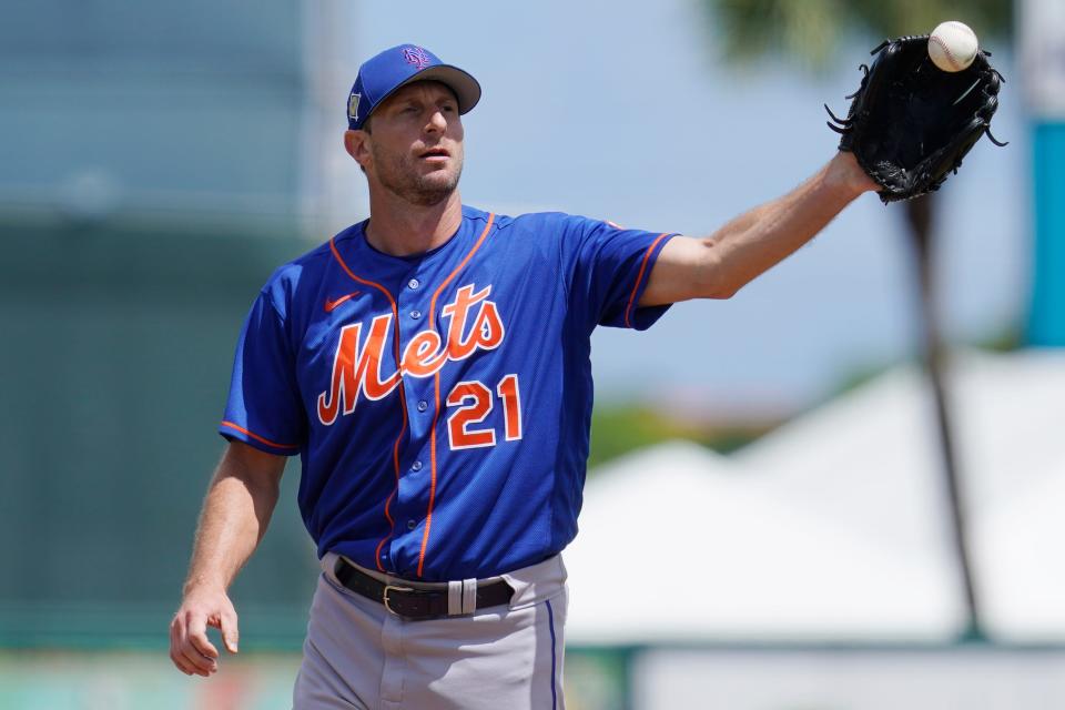 New York Mets' Max Scherzer takes a throw from the catcher in the second inning of a spring training baseball game against the Miami Marlins, Monday, March 21, 2022, in Jupiter, Fl. (AP Photo/Sue Ogrocki)