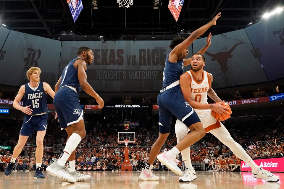 Texas forward Timmy Allen looks for an angle for a shot during Monday night's 87-81 overtime win over Rice. Allen finished the game with 15 points on an emotional day for the Longhorns. Texas head coach Chris Beard was suspended indefinitely.