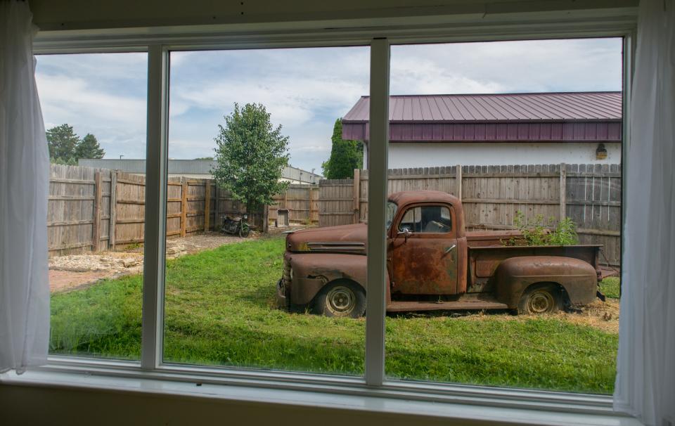 Some of the props used at the former Buckman Portrait Art studio are still available for use in a courtyard at the new Muse co-working space in Morton.