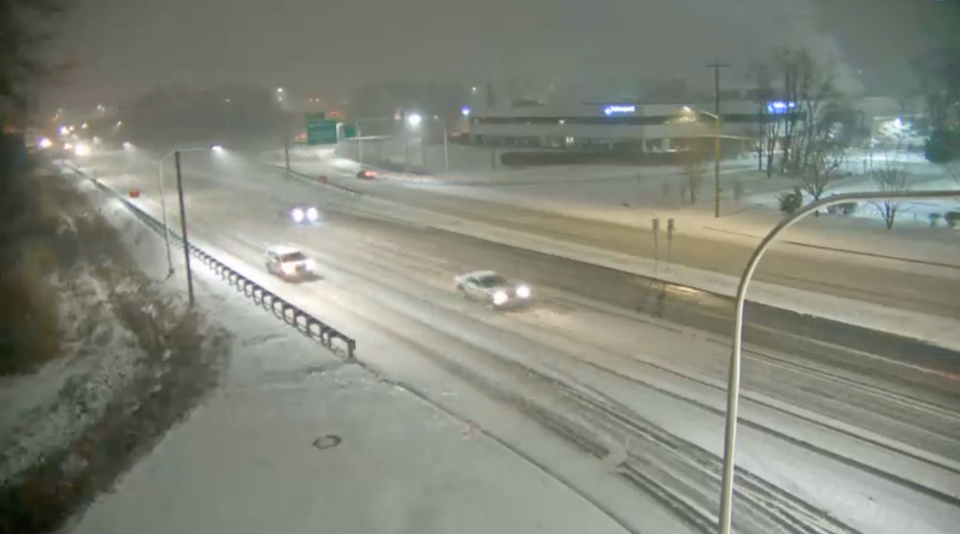 Motorists navigate snow covered roads Monday night in New Castle County