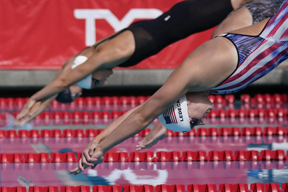 Katie Ledecky dives in to the pool at the start of the women's 1500-meter freestyle final at the TYR Pro Swim Series swim meet Sunday, April 11, 2021, in Mission Viejo, Calif. Ledecky finished first. (AP Photo/Ashley Landis)