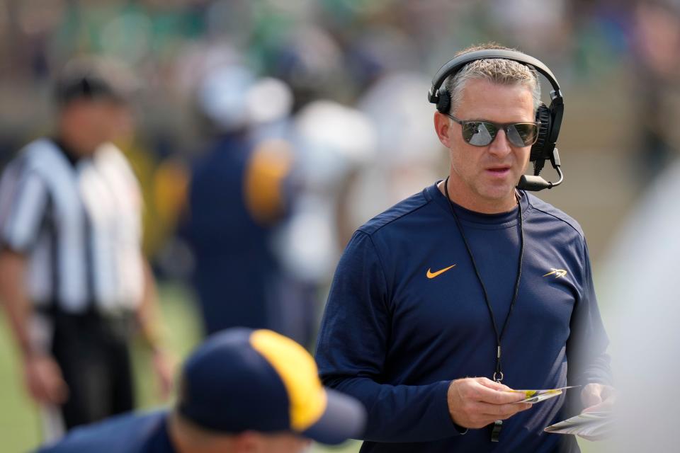 Toledo head coach Jason Candle roams the sideline before the second half of an NCAA college football game against Notre Dame in South Bend, Ind., Saturday, Sept. 11, 2021. Notre Dame won 32-29. (AP Photo/AJ Mast)