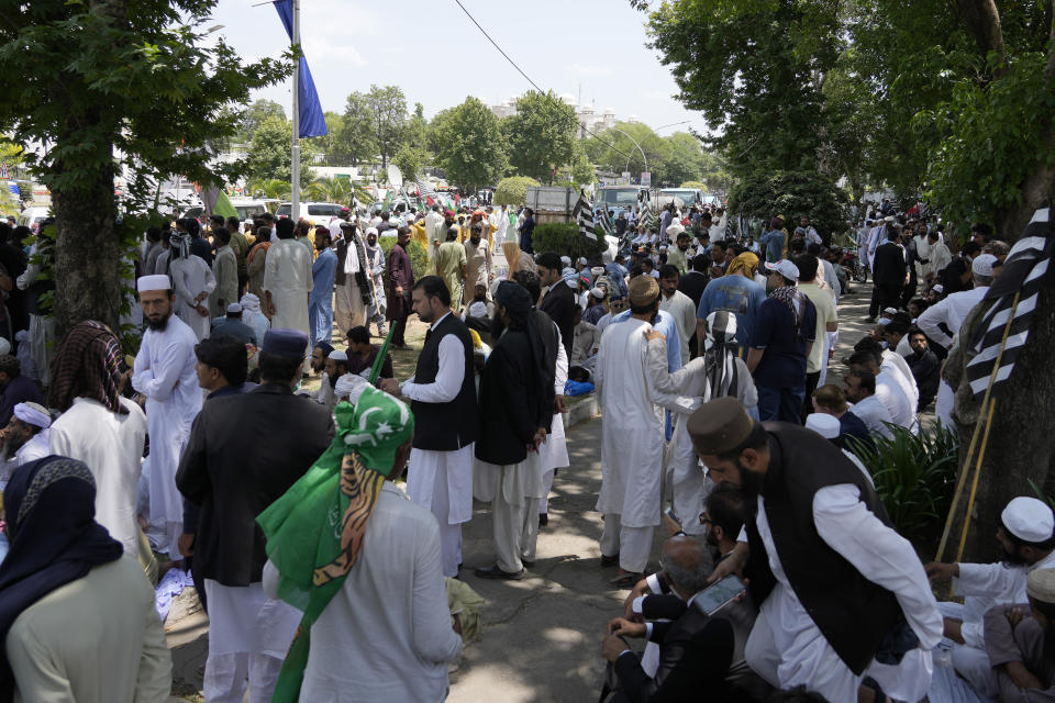 Supporters of Pakistan Democratic Movement, an alliance of the ruling political parties, take part in a rally outside the Supreme Court in Islamabad, Pakistan, Monday, May 15, 2023. Convoys of buses and vehicles filled with Pakistani pro-government supporters are flooding the main road leading to the country's capital on Monday to protest the release of former Prime Minister Imran Khan. (AP Photo/Anjum Naveed)