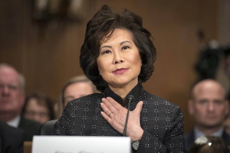 Secretary of Transportation Elaine Chao introduces Labor Secretary nominee Eugene Scalia during his nomination hearing on Capitol Hill, in Washington, Thursday, Sept. 19, 2019. (AP Photo/Cliff Owen)