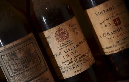 Bottles of vintage cognac, with a royal warrant stamp, are seen in storage inside Berry Bros and Rudd wine merchants in central London, Britain, August 21, 2015. Berry Bros. & Rudd, which started as grocers over 300 years ago in St. James's, central London, has two royal warrants. REUTERS/Toby Melville