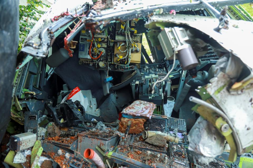 The wreckage of an Air India Express jet is pictured at Calicut International Airport in Karipur, Kerala, on August 8, 2020. - Fierce rain and winds lashed a plane carrying 190 people before it crash-landed and tore in two at an airport in southern India, killing at least 18 people and injuring scores more, officials said on August 8. (Photo by Arunchandra BOSE / AFP) (Photo by ARUNCHANDRA BOSE/AFP via Getty Images)