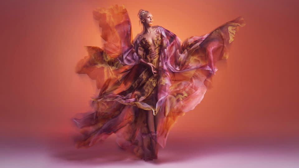 The translucent, layered "Cosmica" dress featuring clouds of color was created in collaboration with artist and former NASA engineer Kim Keever. - Warren du Preez/Nick Thornton Jones