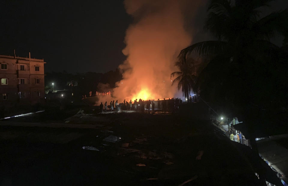 Flames rise from a fire in a makeshift market near a Rohingya refugee camp in Kutupalong, Bangladesh, Friday, April 2, 2021. The fire broke out early Friday when residents of the sprawling Kutupalong camp for Myanmar's Rohingya refugees were asleep. (AP Photo/Shafiqur Rahman)