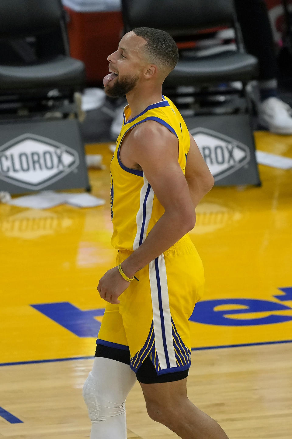 Golden State Warriors guard Stephen Curry (30) reacts after scoring a 3-point shot against the Sacramento Kings during the first half of an NBA basketball game on Sunday, April 25, 2021, in San Francisco. (AP Photo/Tony Avelar)